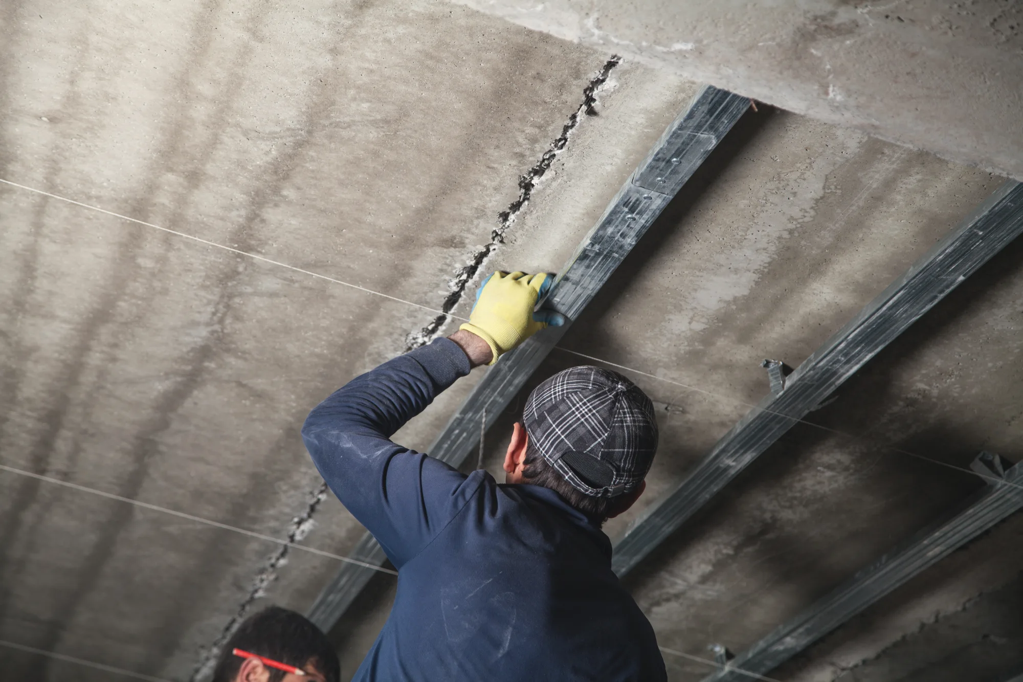 man repairing damaged foundation