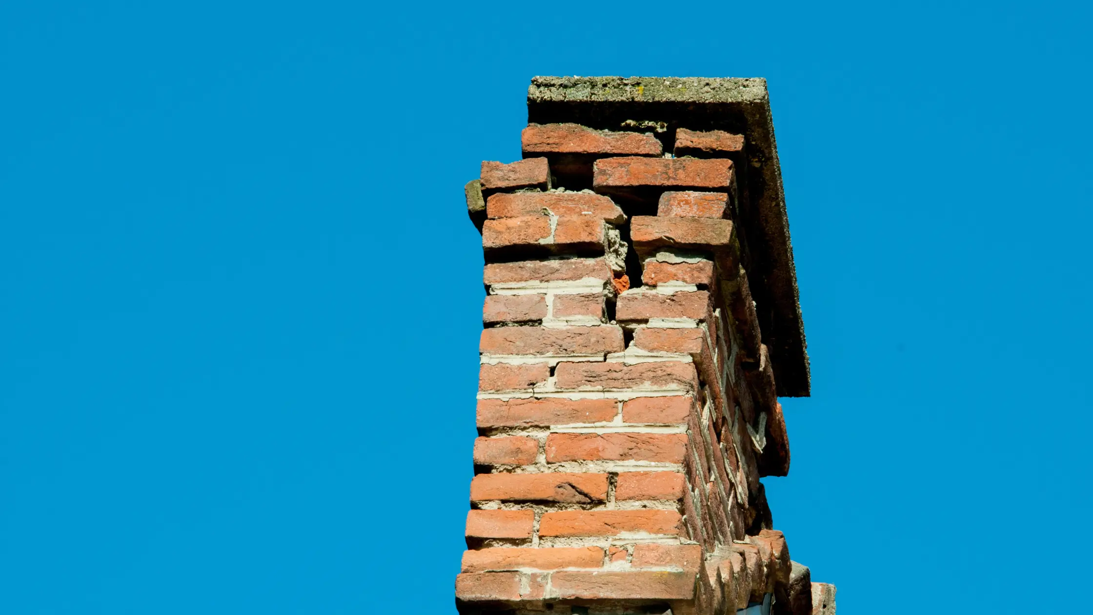 damaged brick chimney